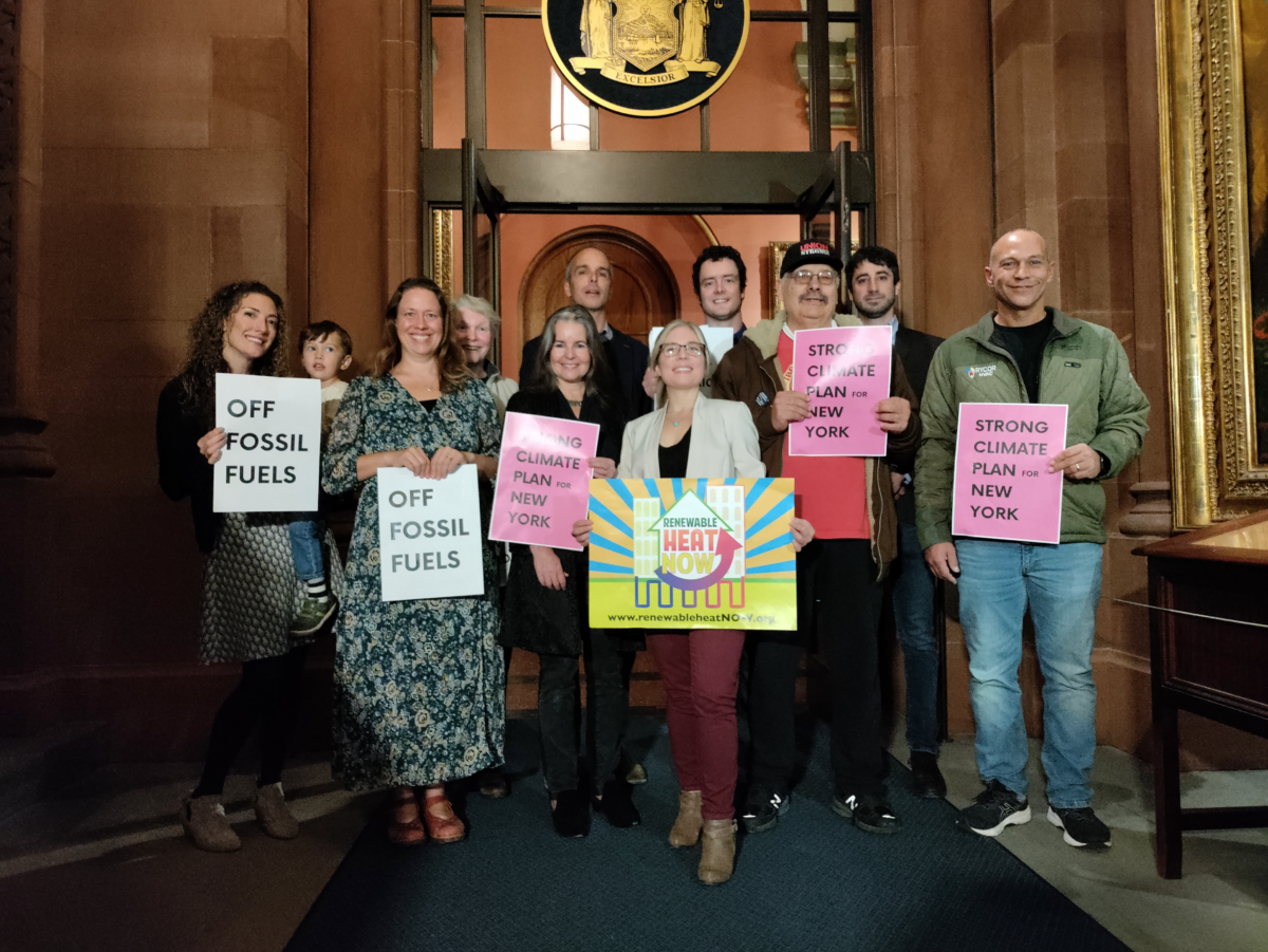 Frack Action members hold signs in Albany, NY.